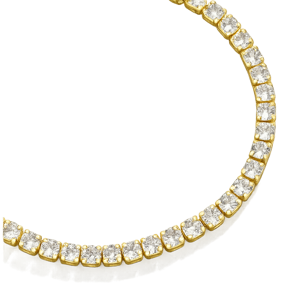 Gold bracelet with clear gemstones on a white background