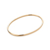 Gold ankle bangle on a white background