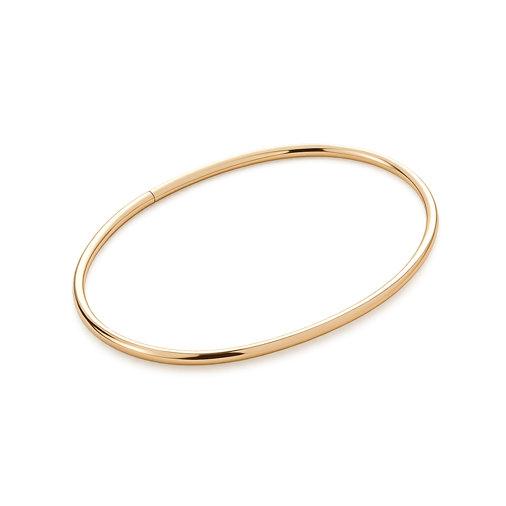 Gold ankle bangle on a white background