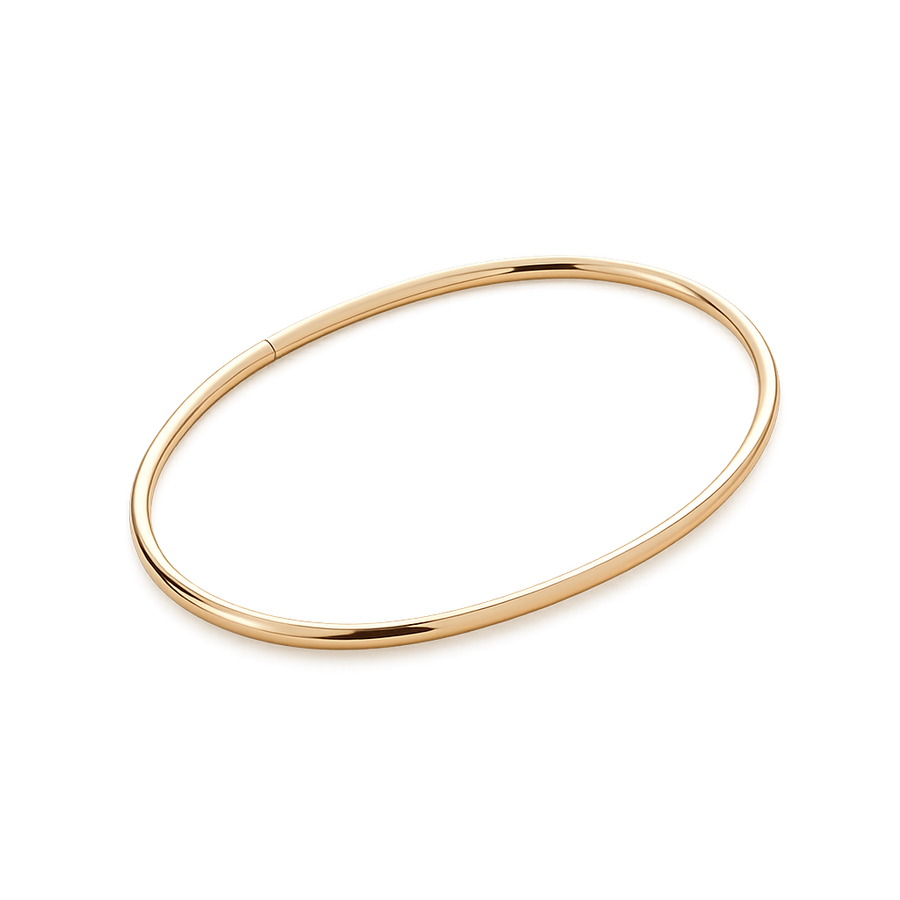 Gold ankle bangle on a white background