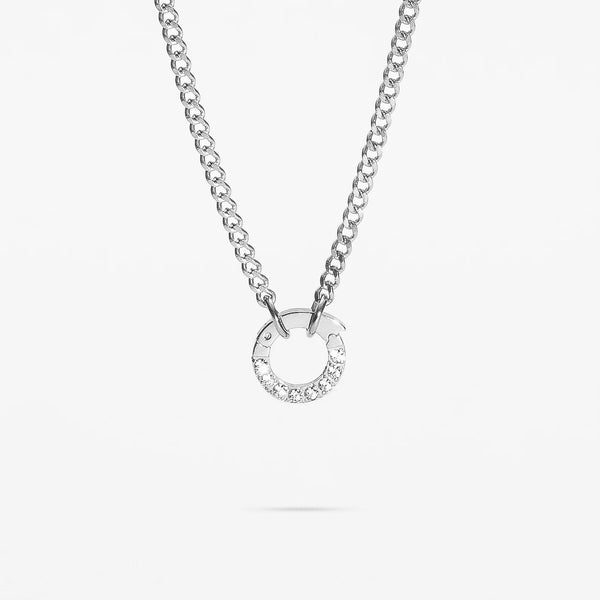 Silver necklace with a circular pendant on a white background