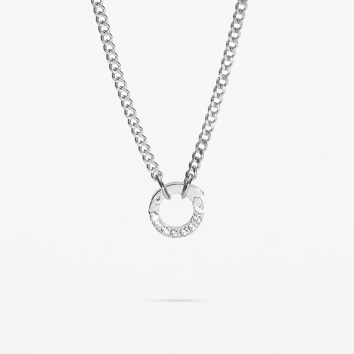 Silver necklace with a circular pendant on a white background