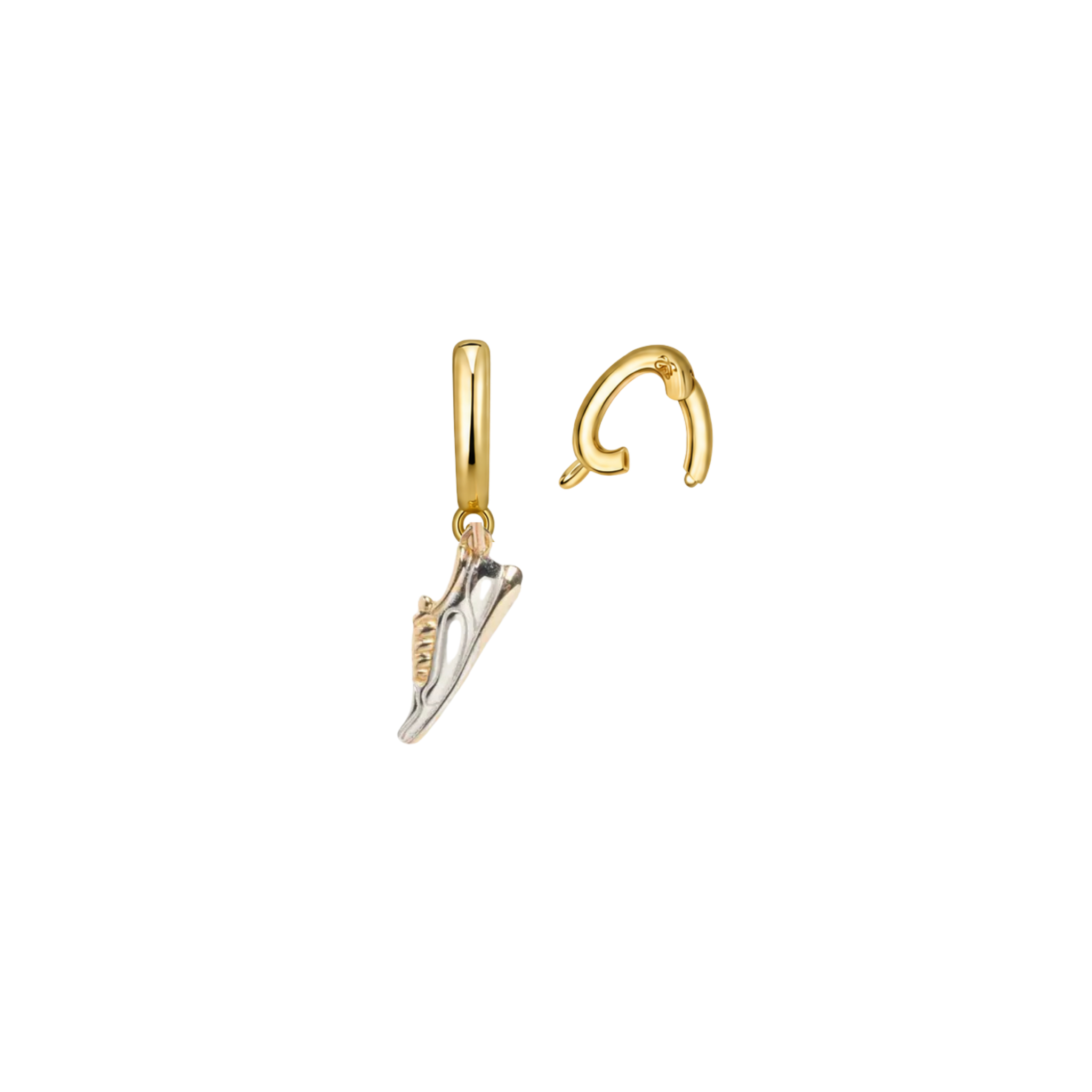 Gold shoe-shaped earrings on a white background