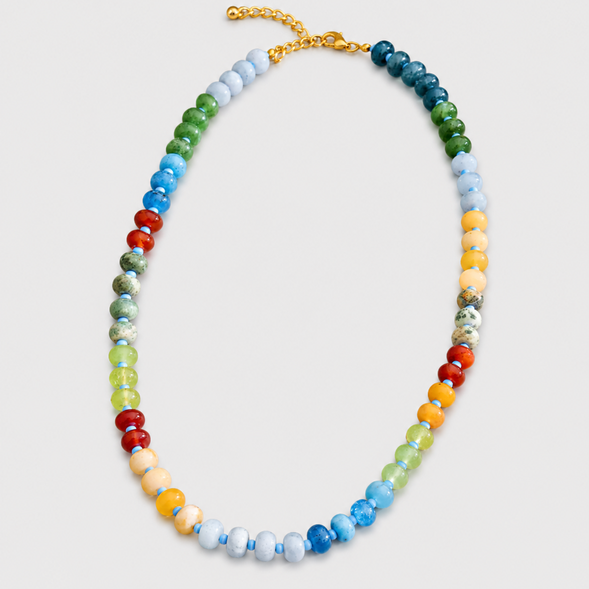 Multicolored beaded necklace on a light gray background