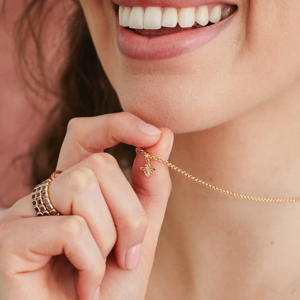 Bee Gemstone Charm necklace being worn on a website page