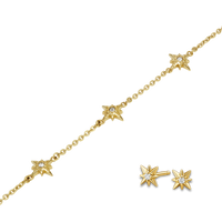 Gold star-shaped jewelry set on a white background