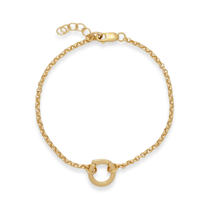 Gold bracelet on a white background