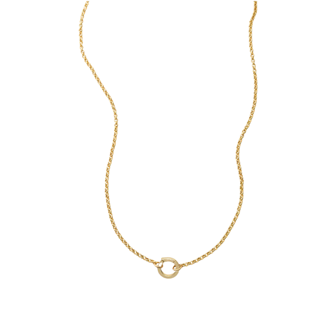 Gold necklace with a small round pendant on a white background