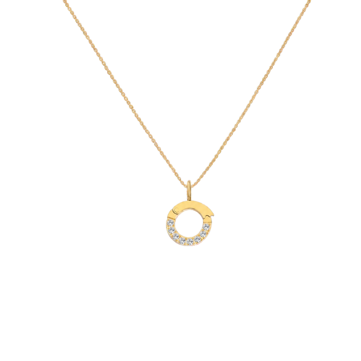 Gold necklace with a circular pendant on a white background