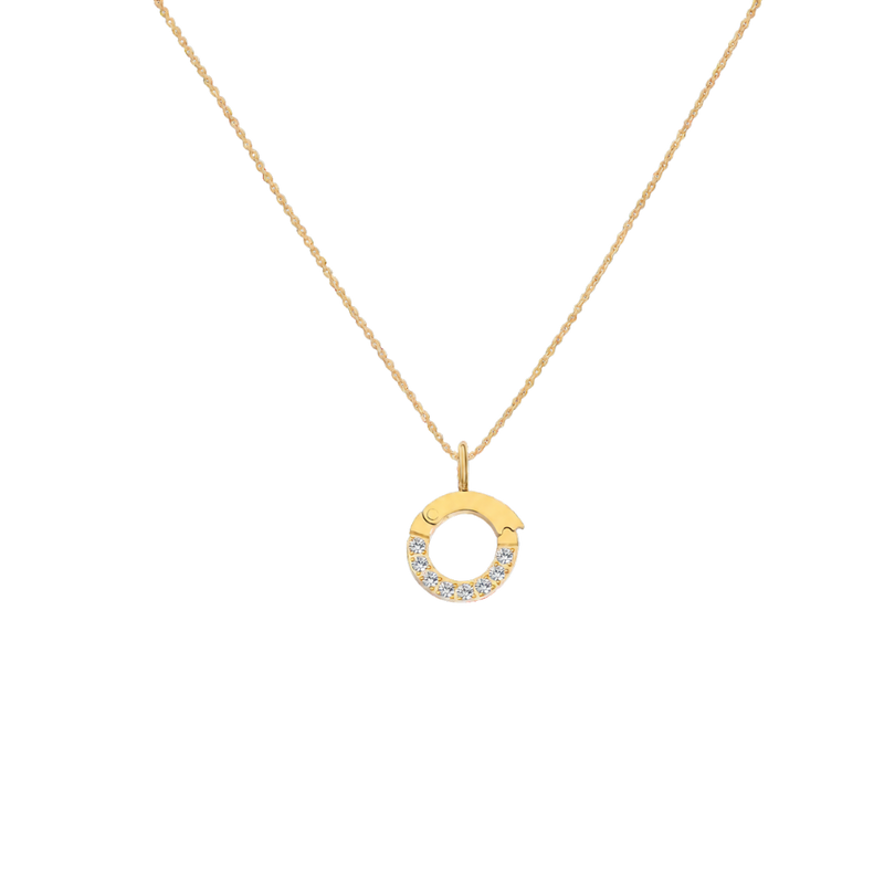 Gold necklace with a circular pendant on a white background