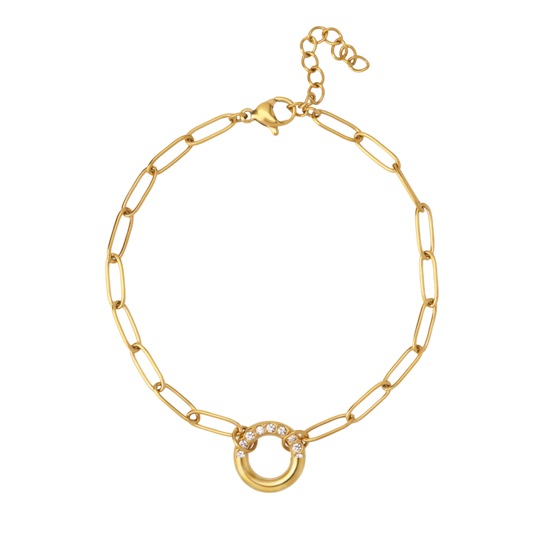 Gold bracelet with a circular charm on a white background