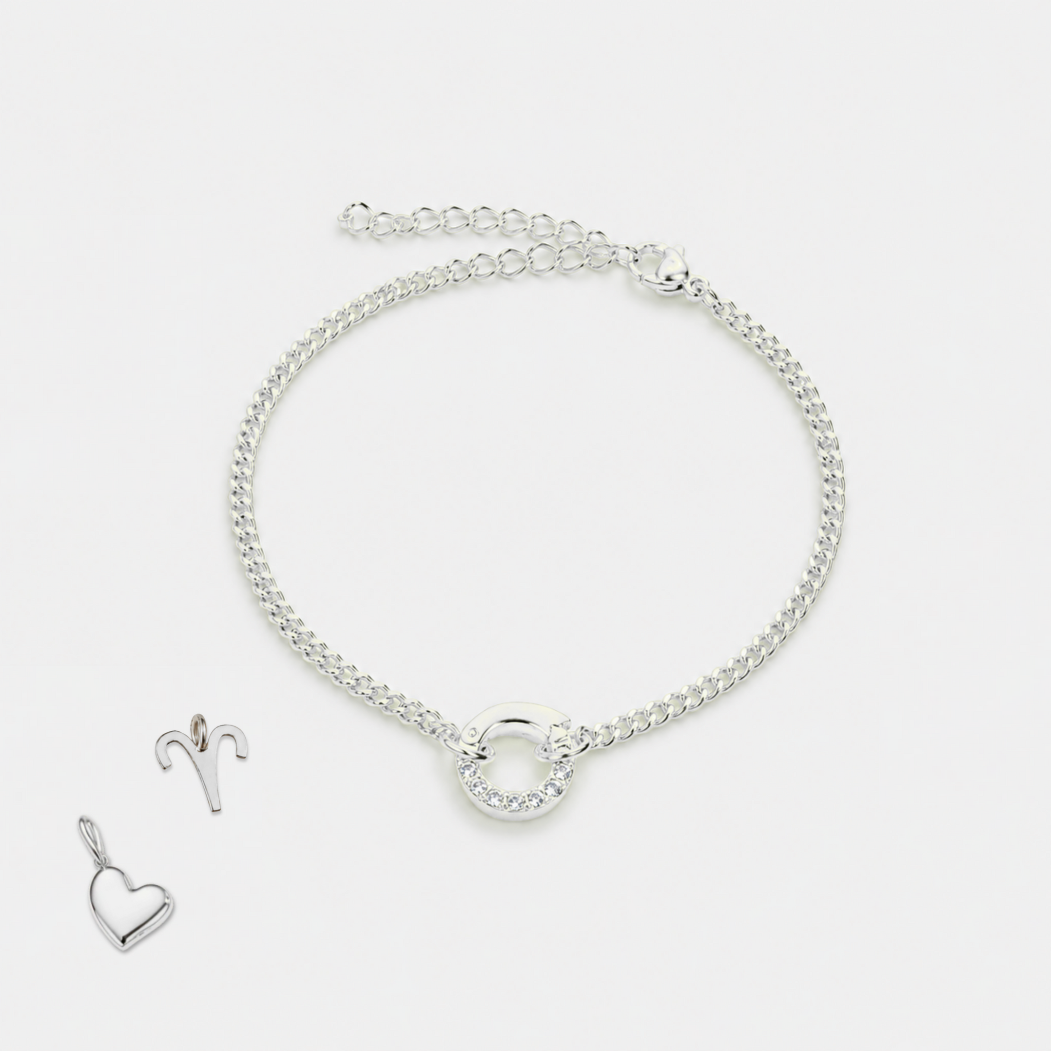 Silver bracelet and heart-shaped pendant on a white background