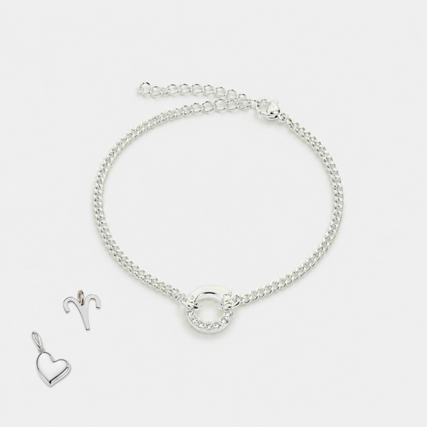 Silver bracelet and heart-shaped pendant on a white background