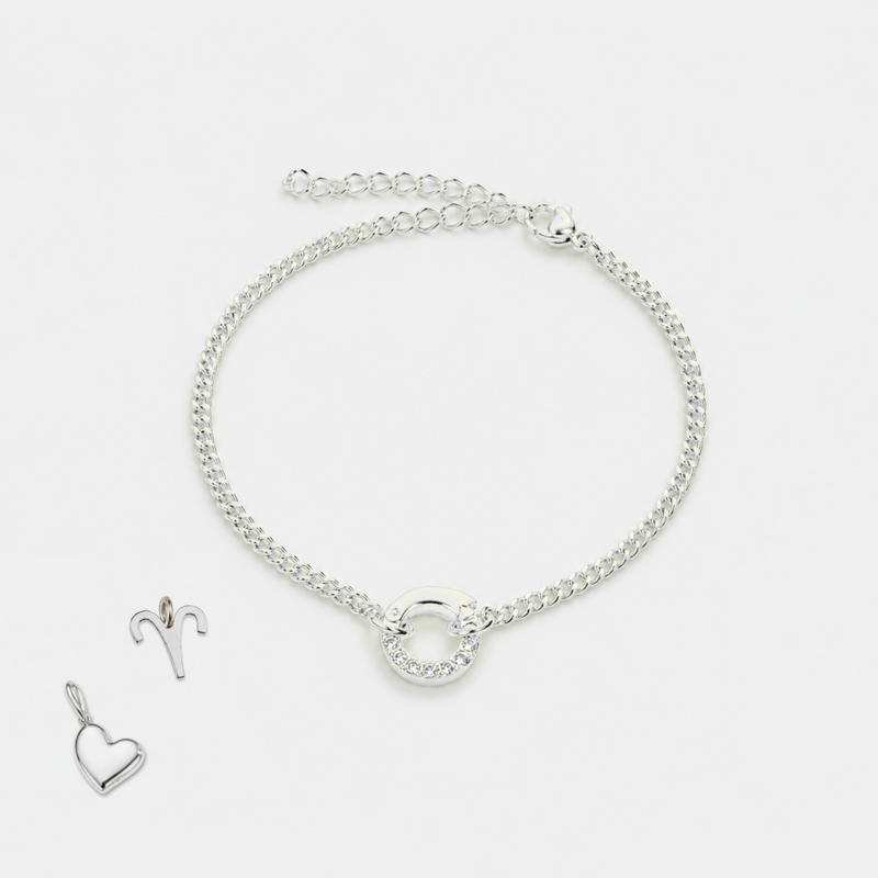 Silver bracelet and heart-shaped pendant on a white background