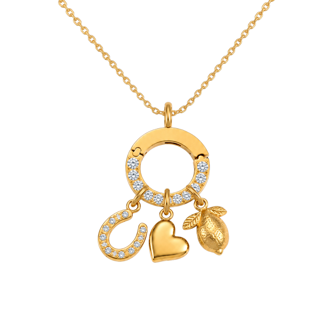 Gold necklace with three charms on a white background