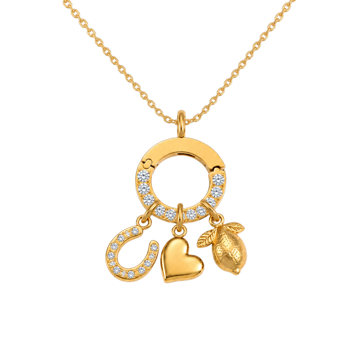 Gold necklace with three charms on a white background