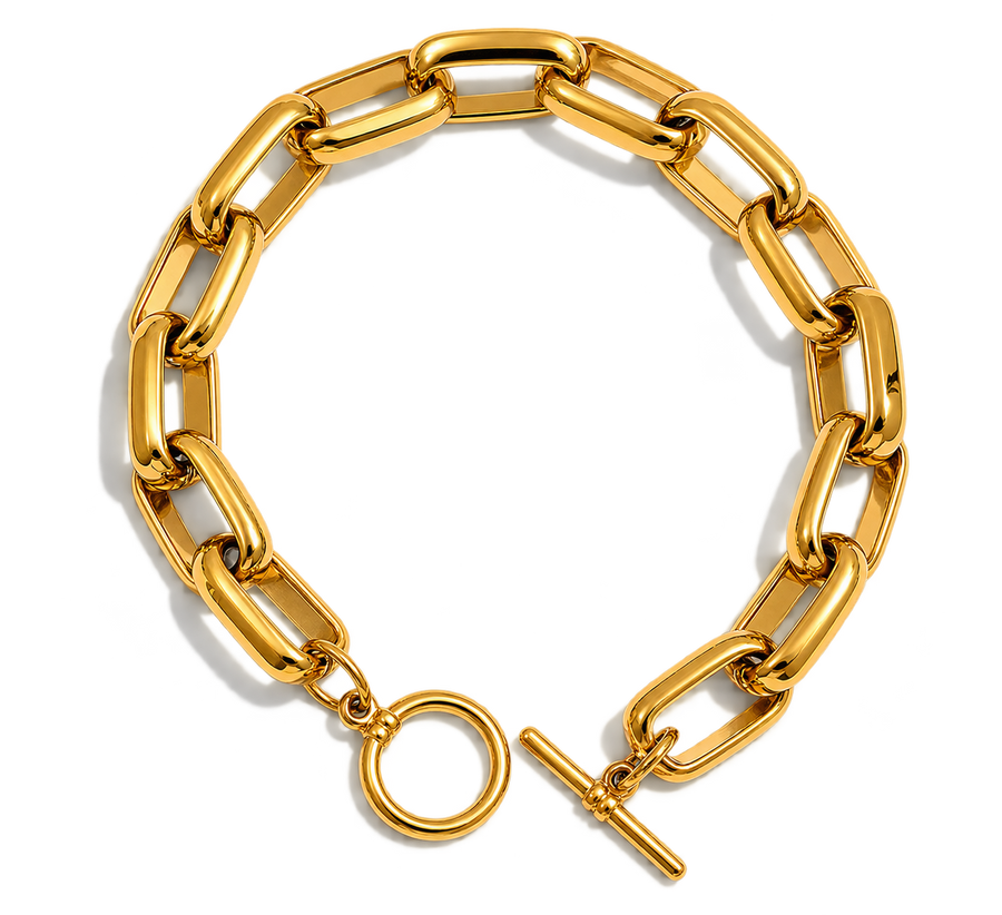 A chunky gold chain link bracelet with a toggle clasp and circular ring detail, displayed on a clean white background.