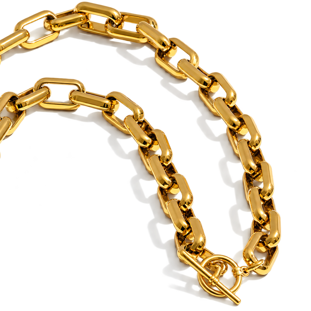 A chunky gold chain necklace with a toggle clasp, displayed on a clean white background.