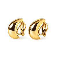 Pair of gold earrings on a white background