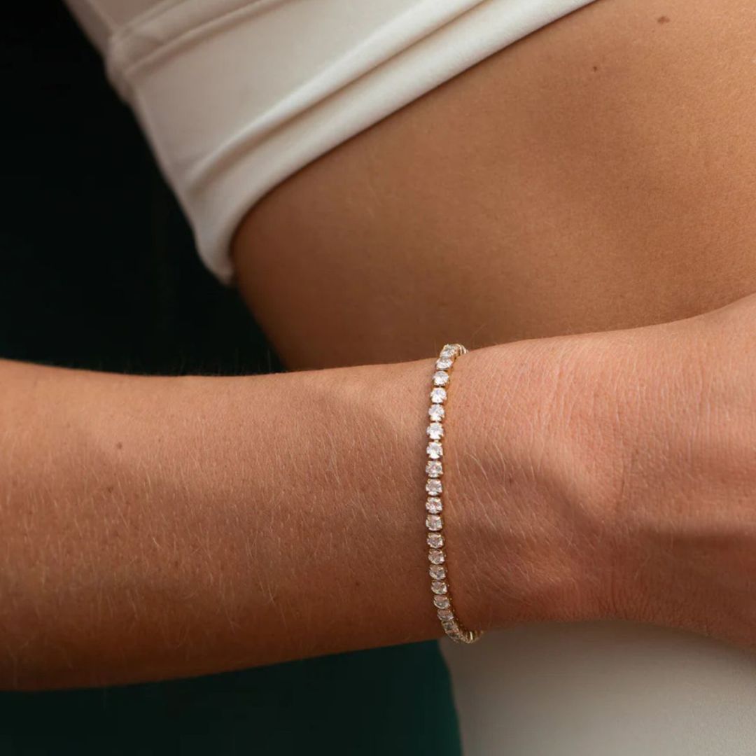 Close-up of a person's wrist wearing a diamond bracelet.