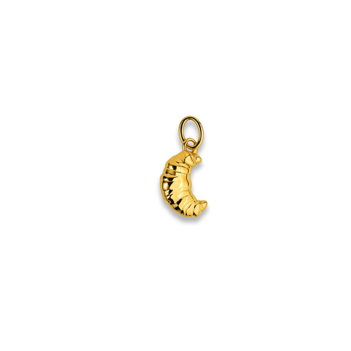 Gold moon-shaped pendant on a white background