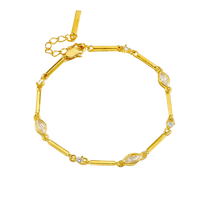 Gold bracelet with marquise-shaped stones on a white background