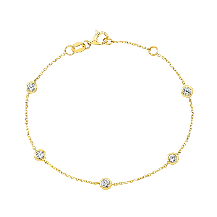 Gold bracelet with diamond accents on a white background