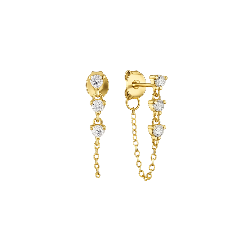 Gold earrings with diamond accents on a white background