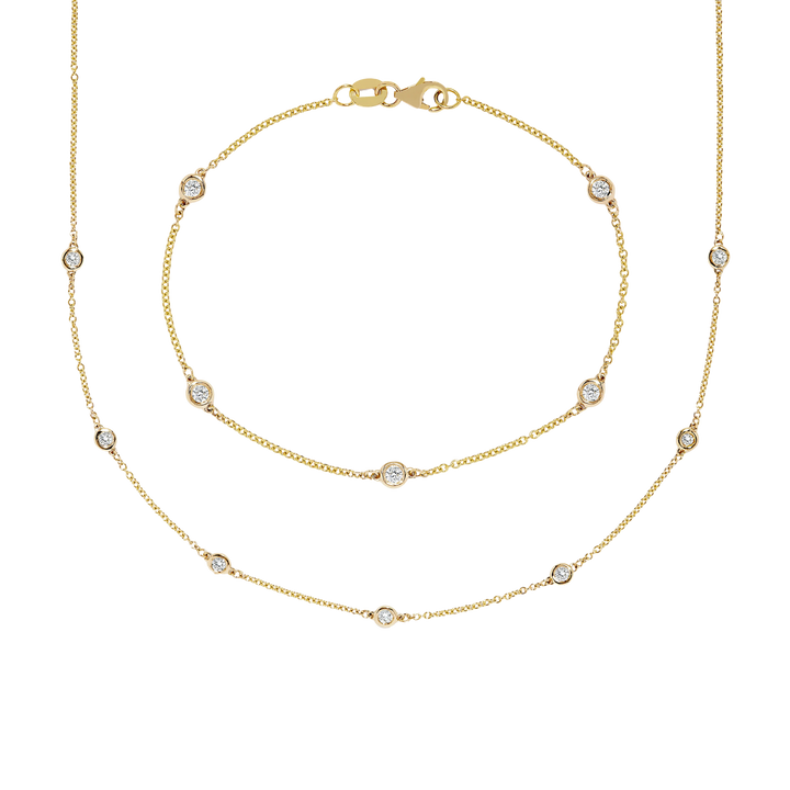 Gold necklace with small diamonds on a white background