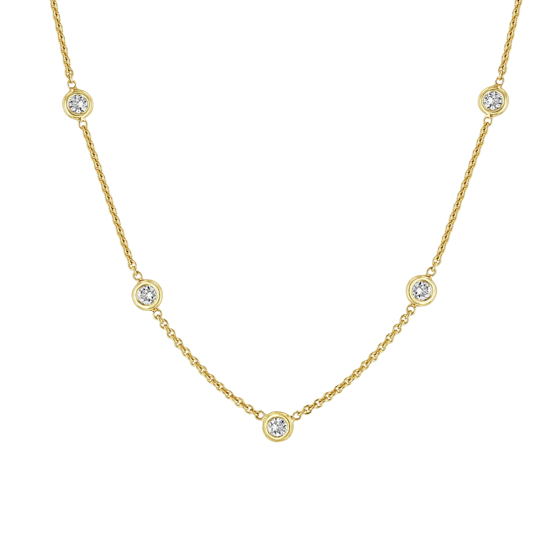 Gold necklace with small diamonds on a white background