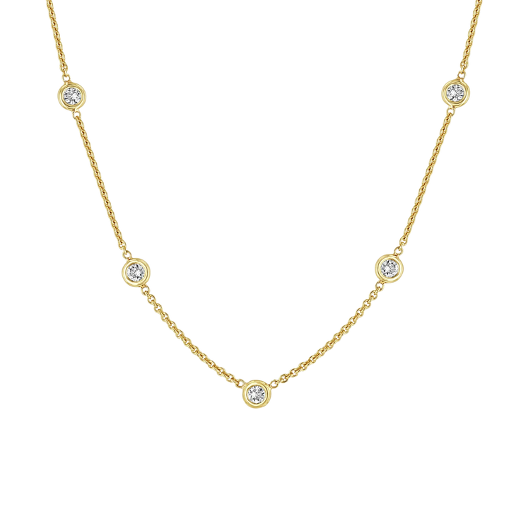 Gold necklace with small diamonds on a white background
