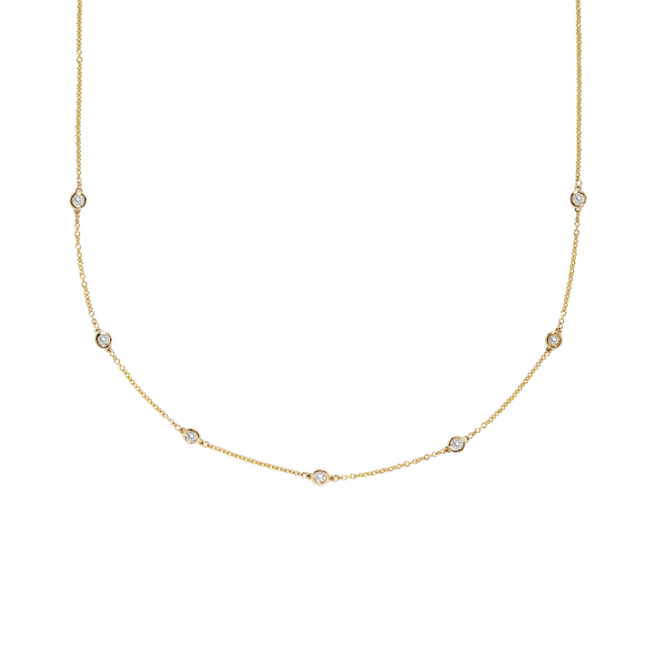 Gold necklace with small diamonds on a white background