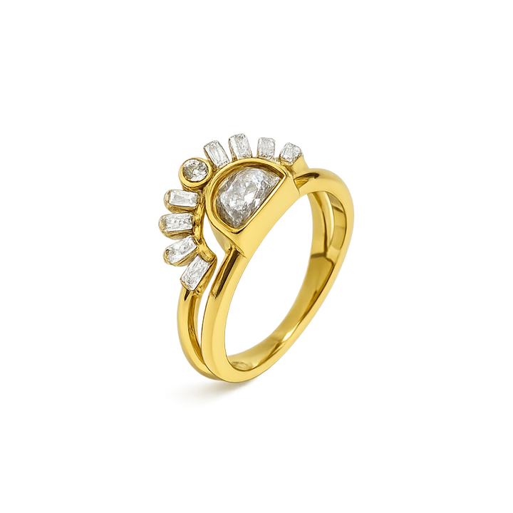 Gold ring with diamond accents on a white background