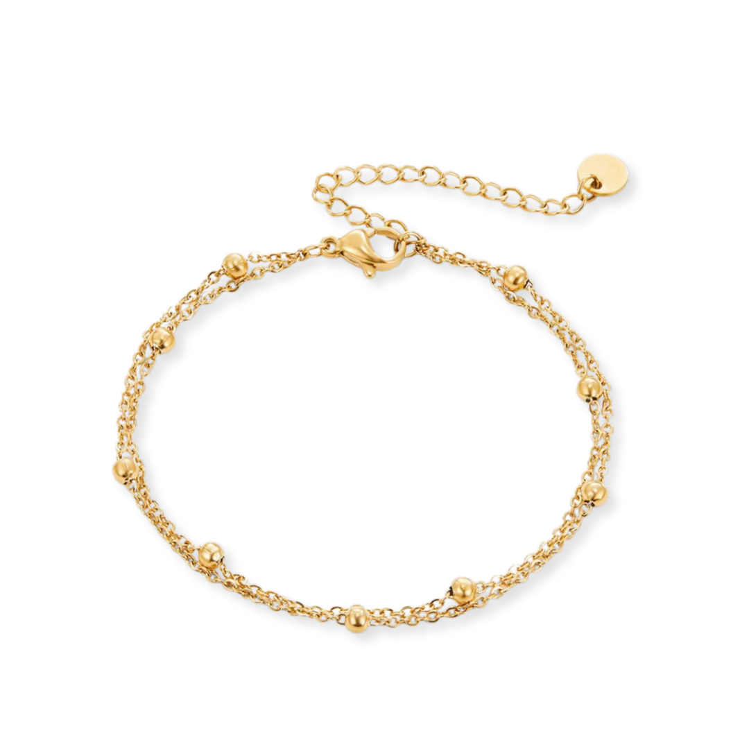 Gold bracelet on a white background