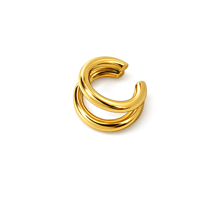 Gold ear cuff on a white background