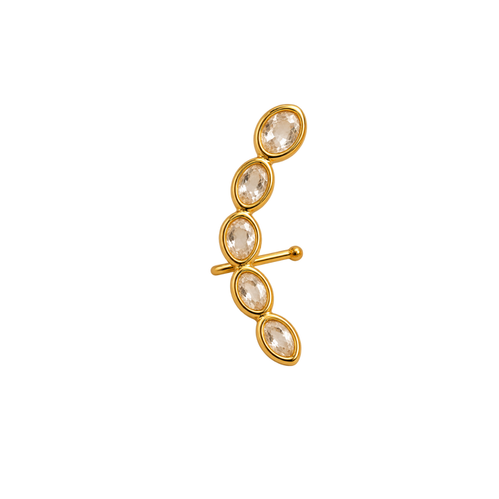 A gold ear cuff earring featuring five clear marquise-cut gemstones in oval bezel settings, shown against a plain white background.