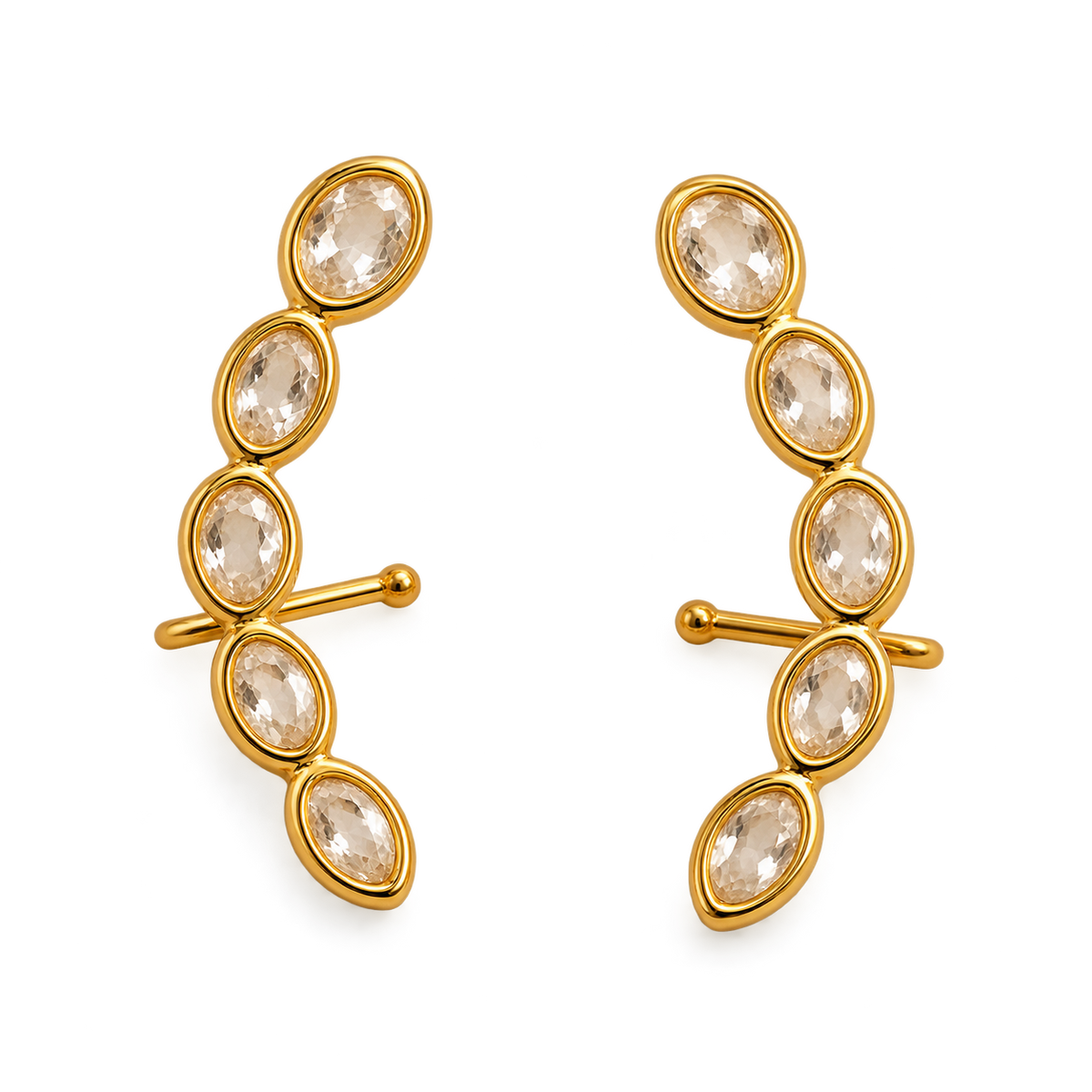 A pair of gold crescent-shaped clip-in earrings, each adorned with five marquise-cut clear crystals in a curved row, set against a plain white background.