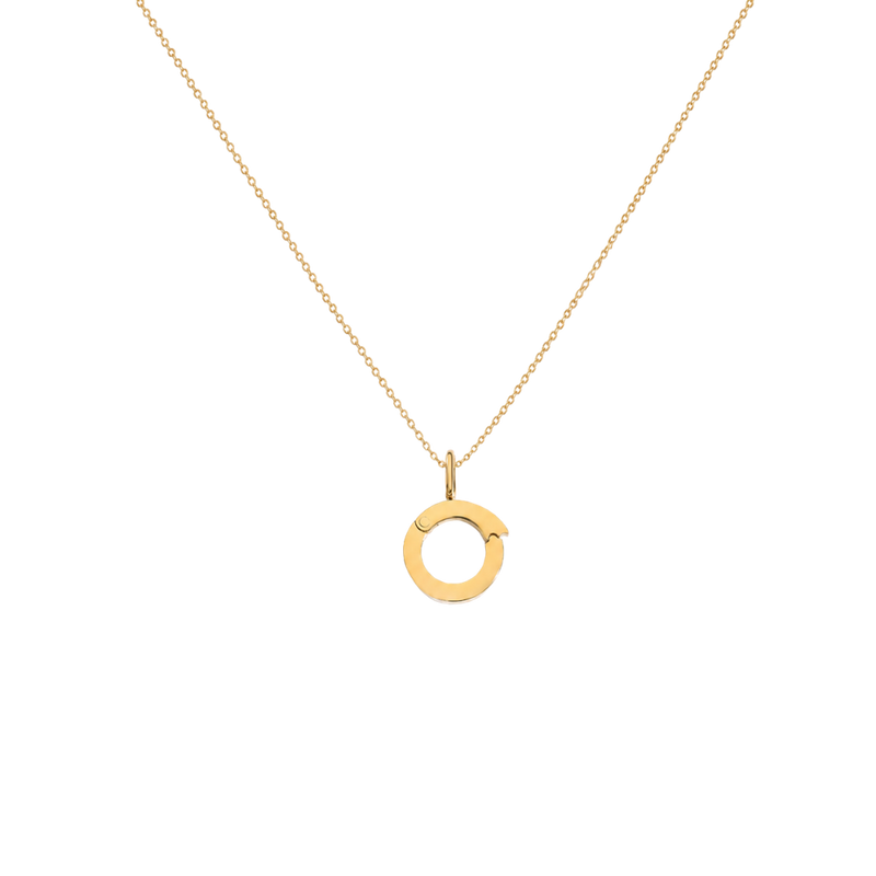 Gold necklace with a circular pendant on a white background