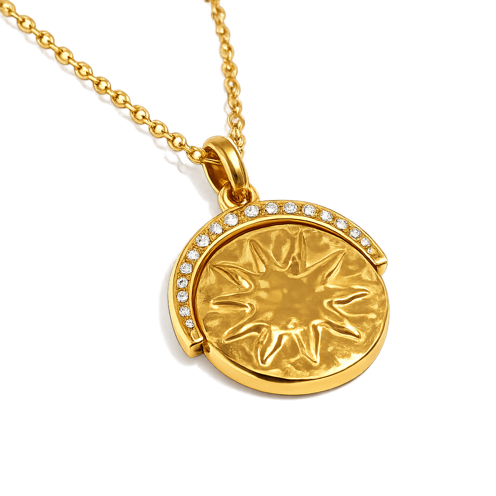Gold necklace with a sun design pendant on a white background