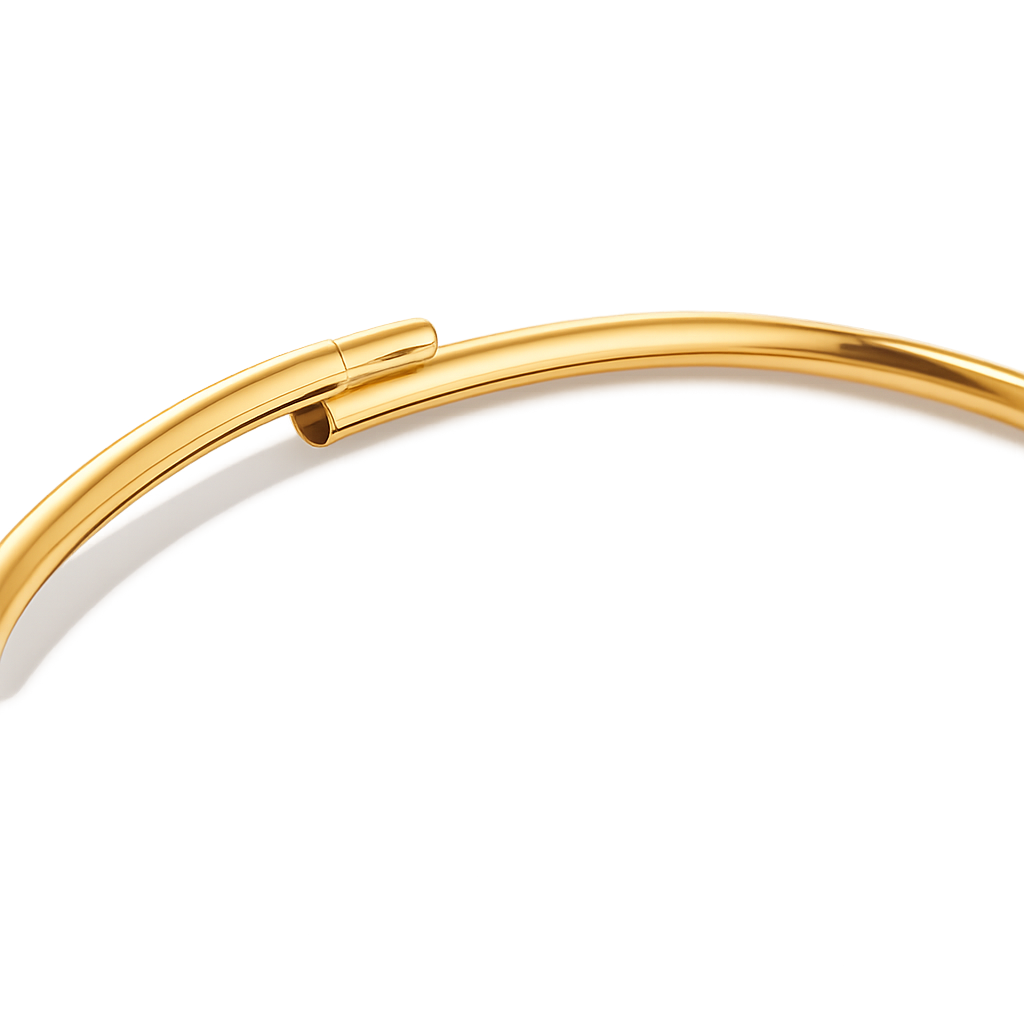 Gold ankle bracelet on a white background