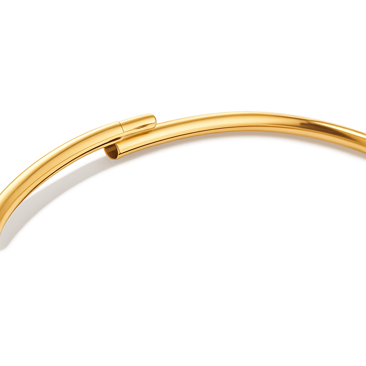 Gold ankle bracelet on a white background