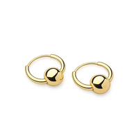 Pair of gold hoop earrings on a white background