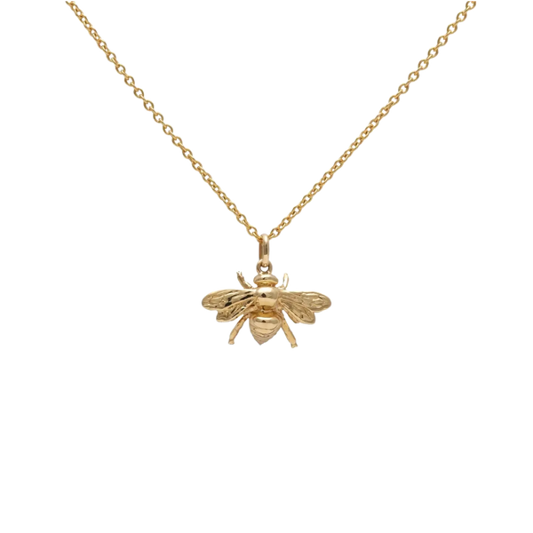 Gold bee pendant necklace on a white background