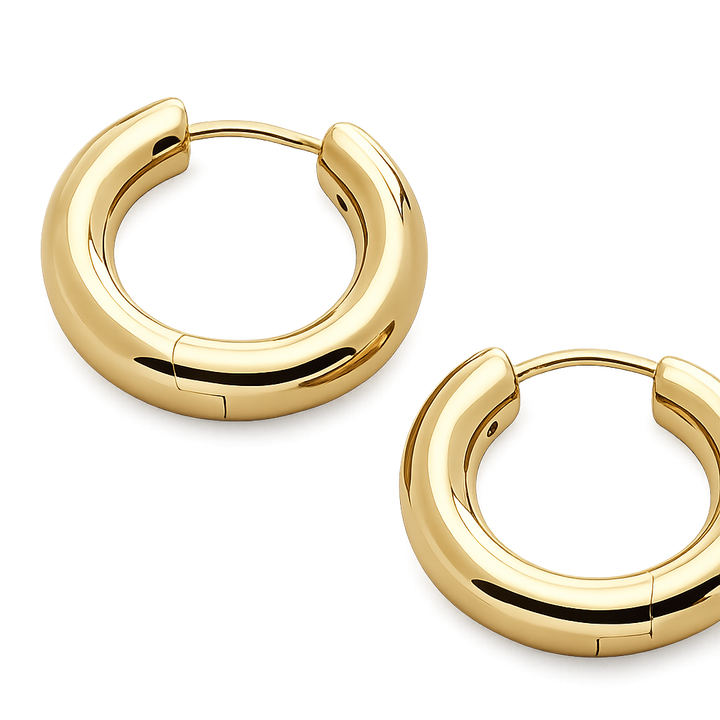 Gold hoop earrings on a white background