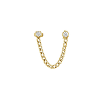 Gold chain earring with diamond-like stones on a white background
