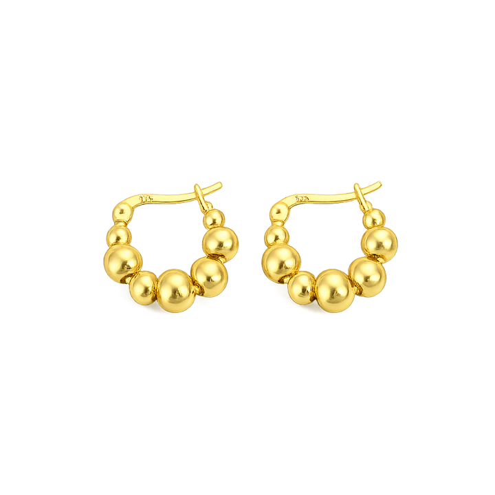 Gold hoop earrings with spherical beads on a white background