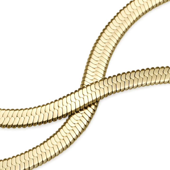 Gold chain necklace on a white background