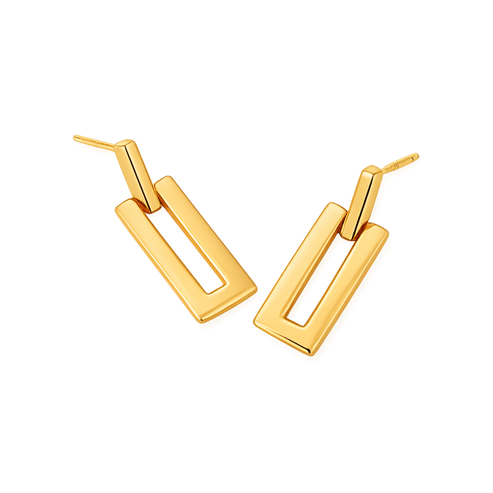 Gold hoop earrings on a white background