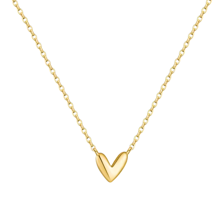 A delicate gold chain necklace featuring a polished, smooth gold heart pendant, shown against a solid white background.