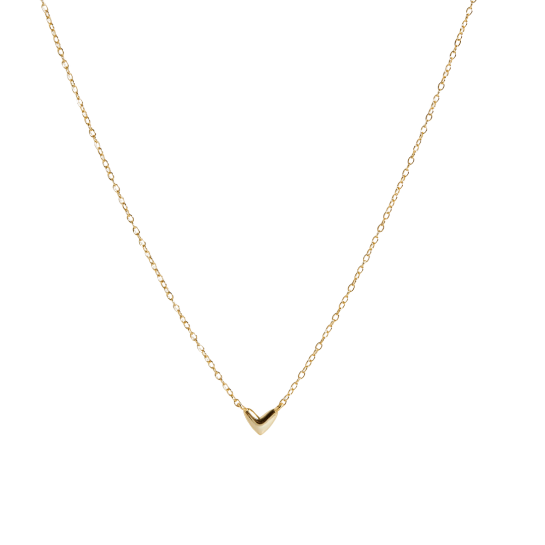 A delicate gold chain necklace featuring a small, polished gold chevron pendant, presented on a clean white background.